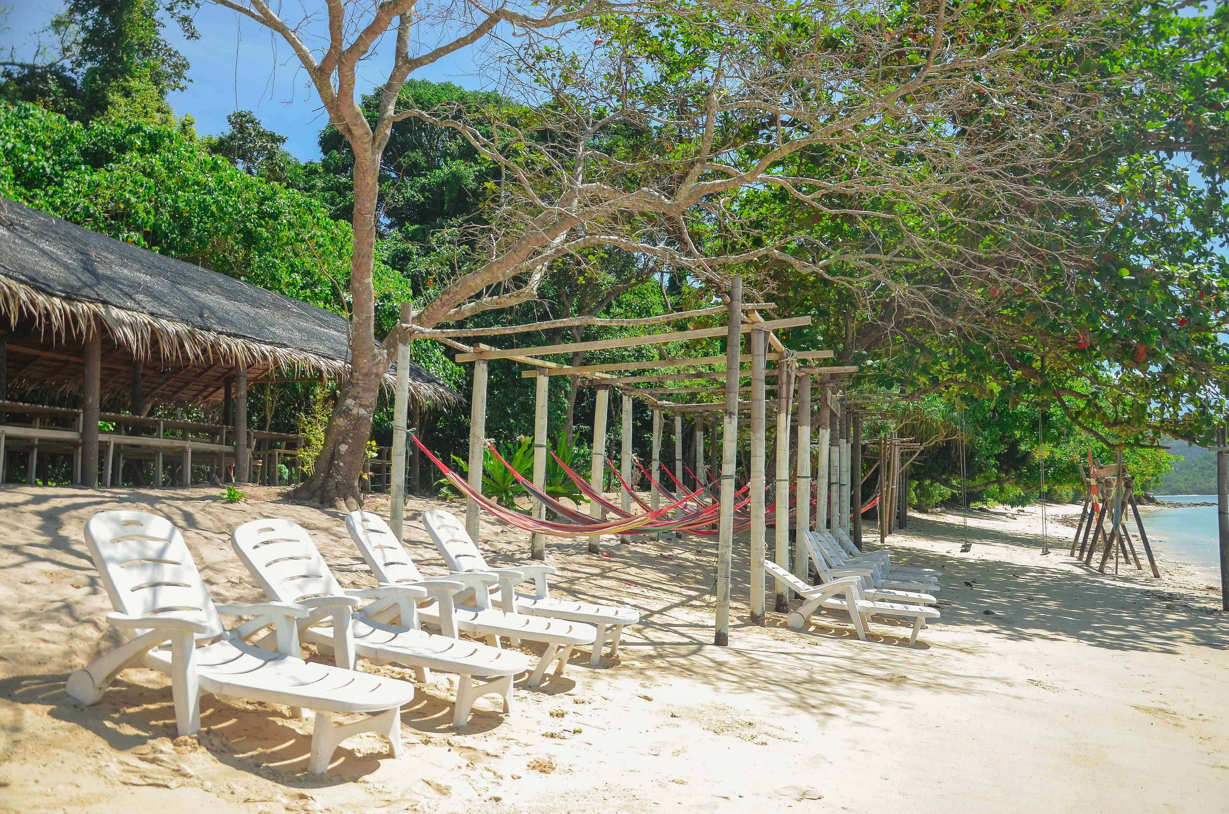 Relax on the private beach at Pandan Pandan Island.