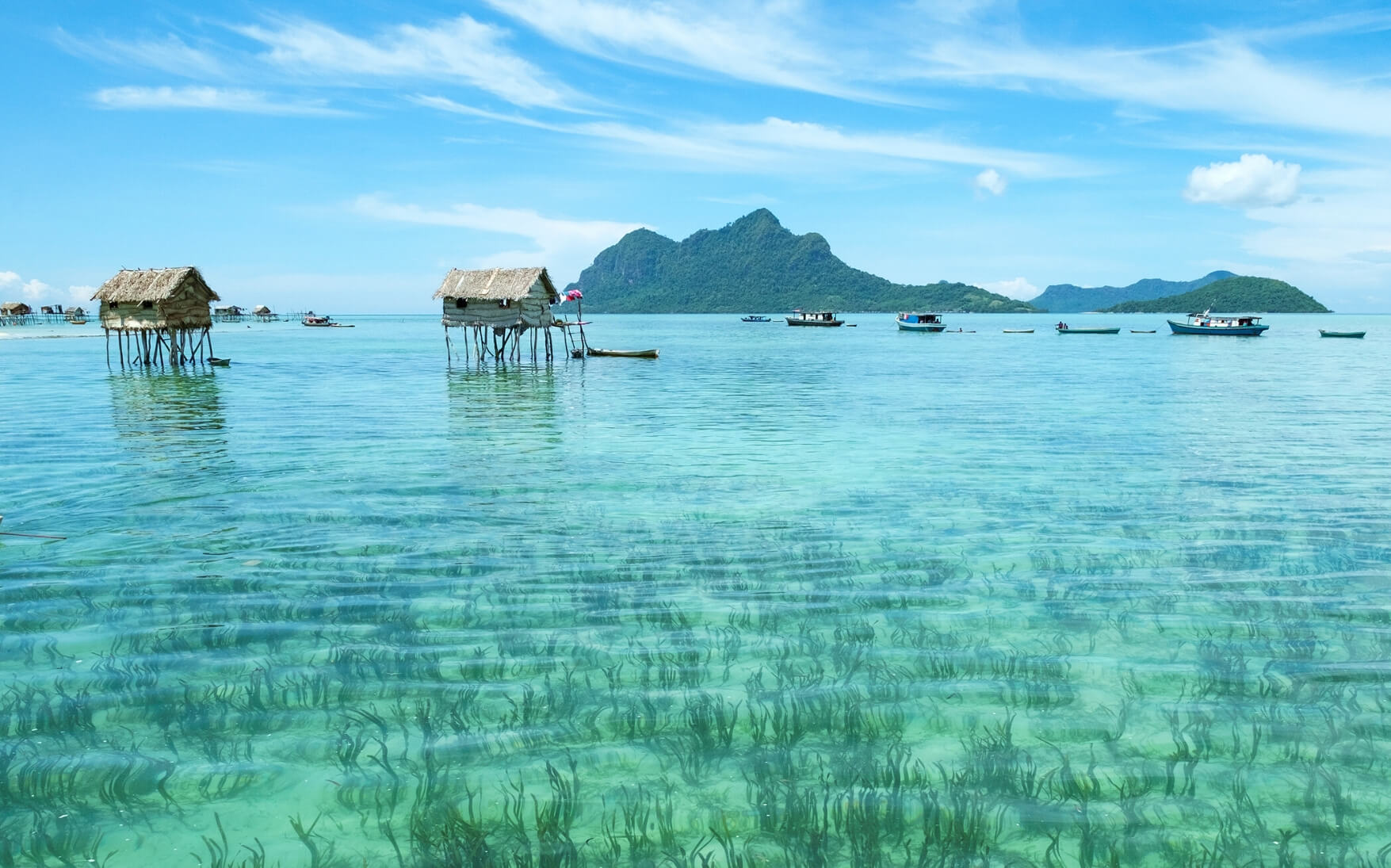 A serene view of the crystalline ocean taken from Mabul Island.