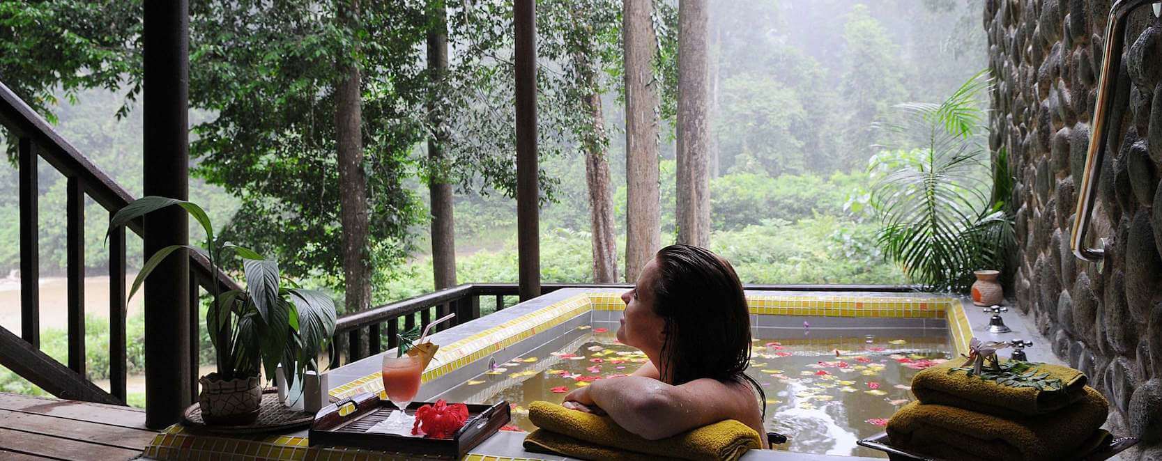 Outdoor private bathtub at deluxe chalet balcony