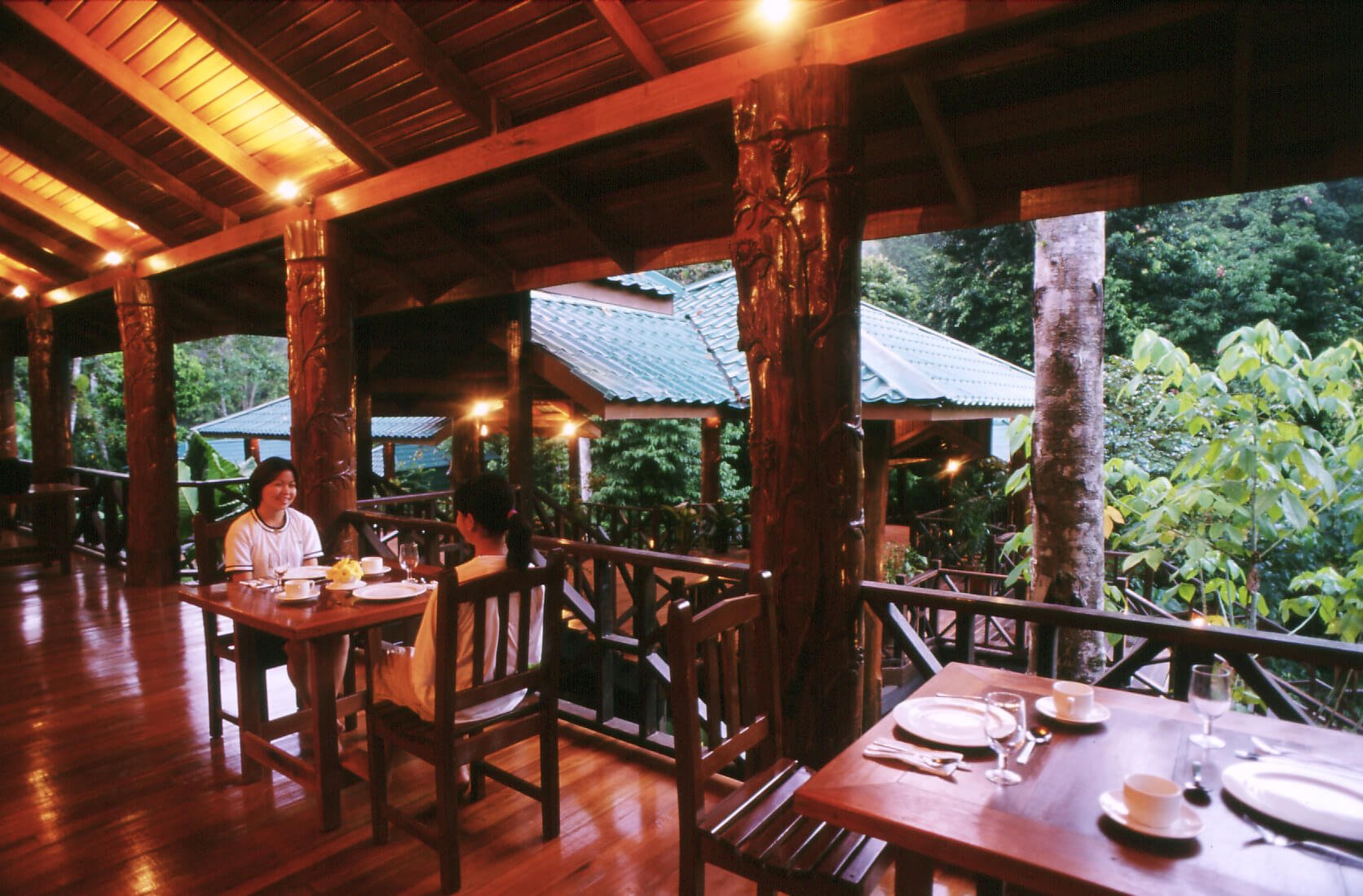 Full board meals provided in this restaurant, complete with a view of the lush rainforest.