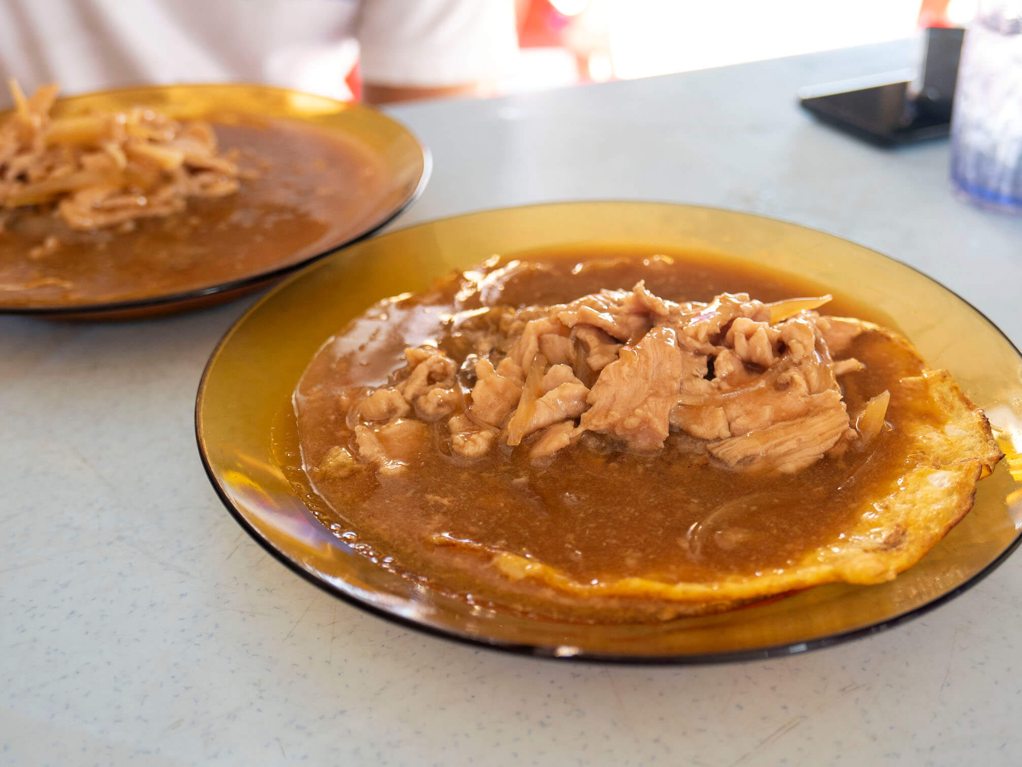 Papa Kopitiam's Crispy Fried Mee Hoon topped with fried egg, pork slices and delicious gravy