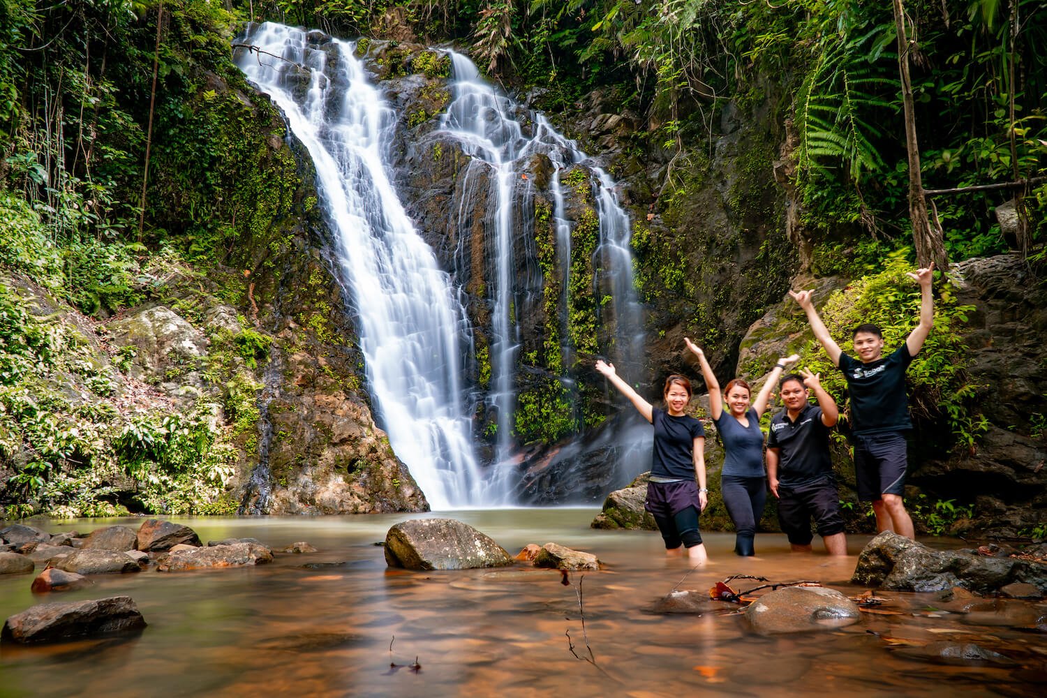 Freshen up in Bukit Gelas Waterfall after trekking.