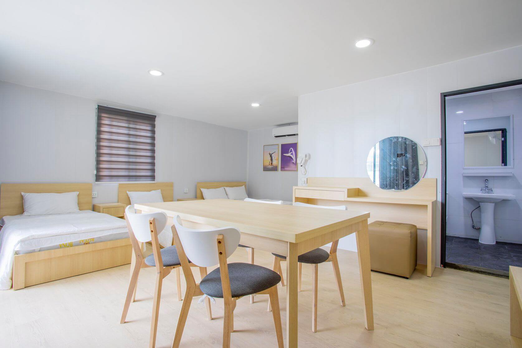 Family room at Little Dolphin Mantanani Resort can fit up to 4 pax decorated with modern arts and furniture