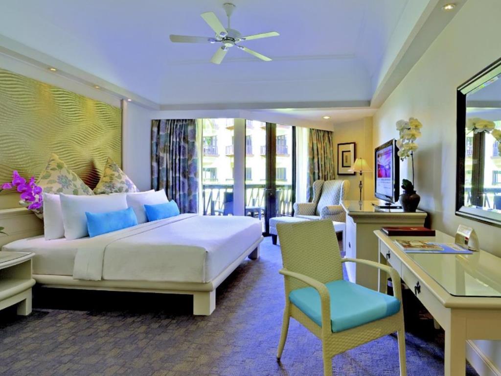 Deluxe Garden View offers a beautiful room equipped with full amenities and a private balcony overlooking the resort's garden.
